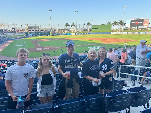 Hunter Bruce with his sister, grandparents and aunt at a baseball game