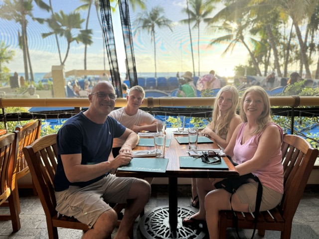 Hunter Bruce dining with his parents and twin sister